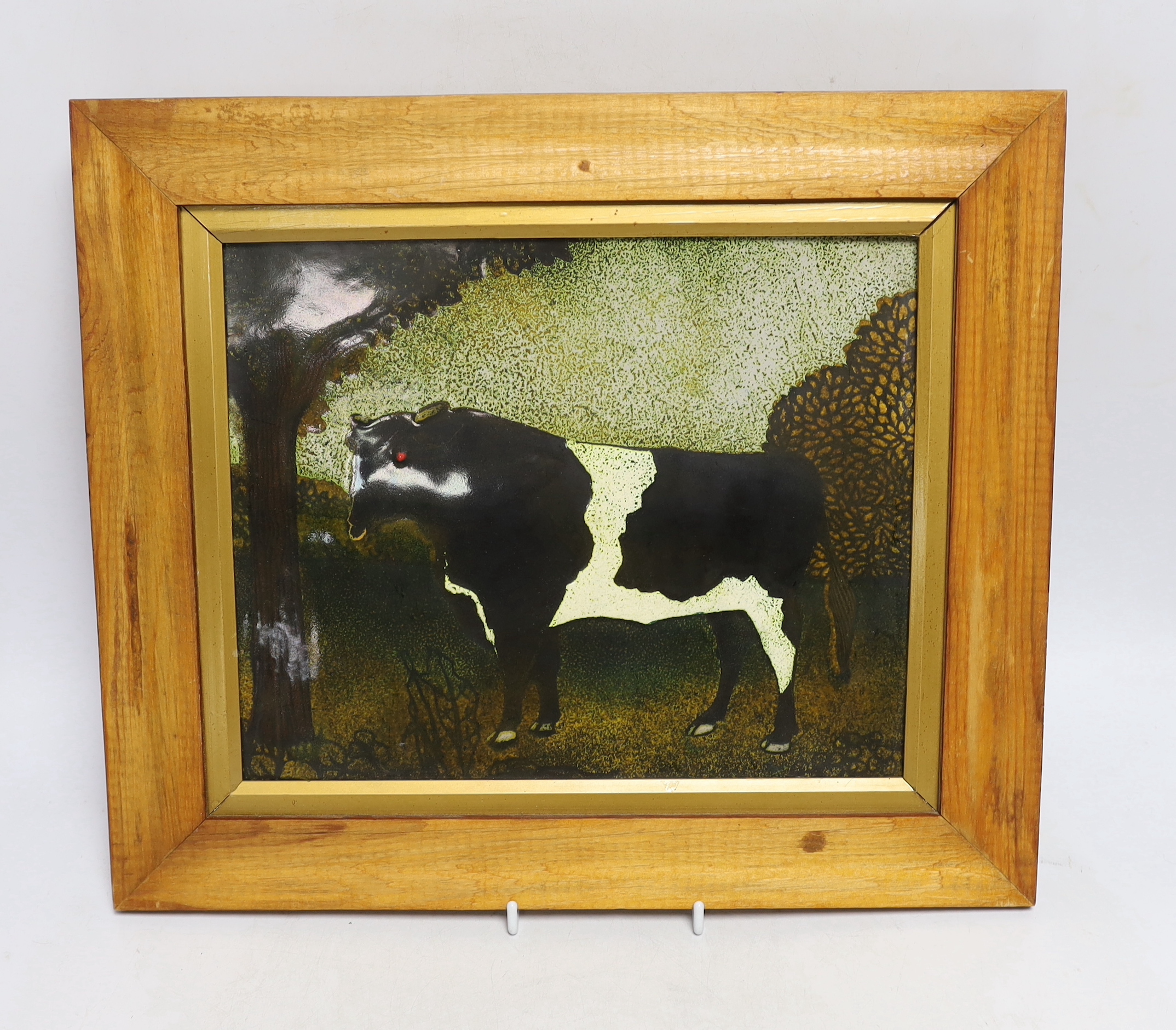 A framed Digby Turpin, enamelled plaque of a bull, 39cm wide x 34cm high including frame